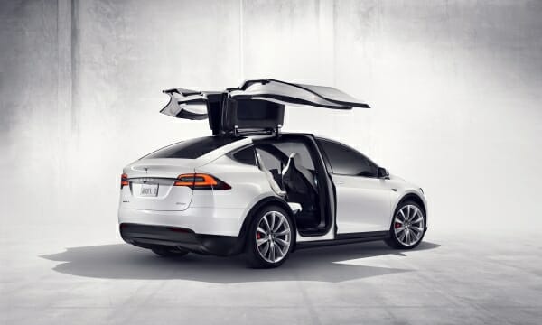 white Tesla Model X with falcon wing doors